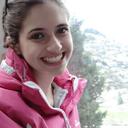 Sarah M. smiling outdoors in a pink jacket - German A1 student from Berlin